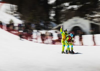 Photography of two people dressed up as ninja turtles skiing on summer day, approaching small lake to ski across.