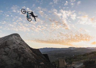 Huge air from dirt jumping mountain biker doing a off bike can can.