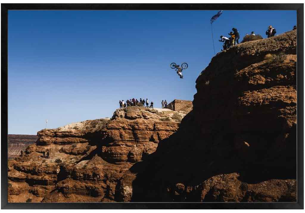 Pro mountain biker, Cam Zink, throwing a massive backflip at the Red Bull Rampage in Virgin, UT. Photo by Ryan Cleek