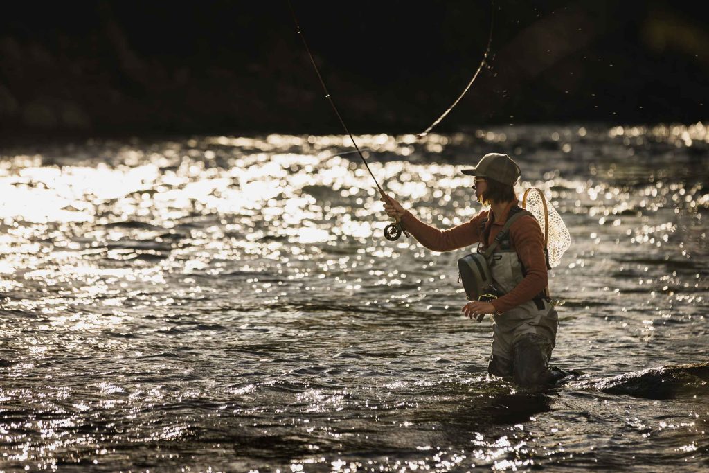 Fly fishing woman, Brierly Grace, on Truckee River in Reno, NV. Photo by Ryan Cleek