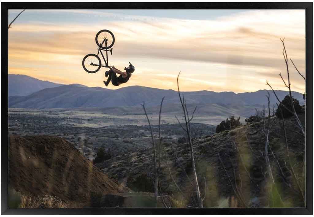 Freeride mtb flip whip at sunset. Photo by Ryan Cleek