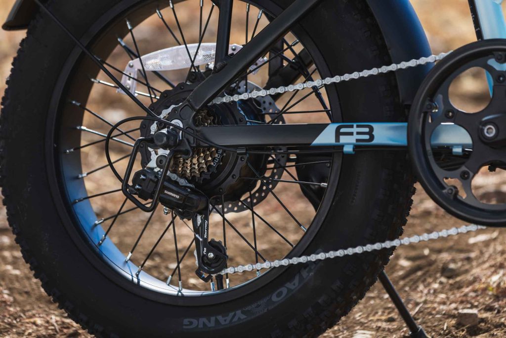  detailed electric bike photography showcasing components and build quality of GoTrax F3. Shimano drivetrain and chain
