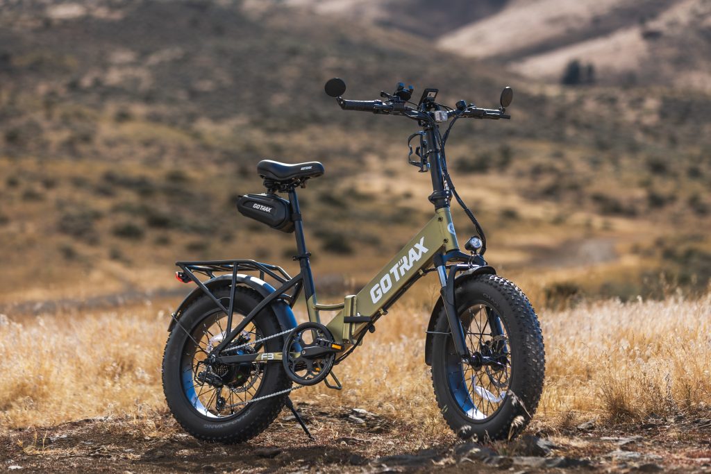 commercial e-bike photography for GoTrax F3 fat tire folding e-bike in real outdoor terrain
