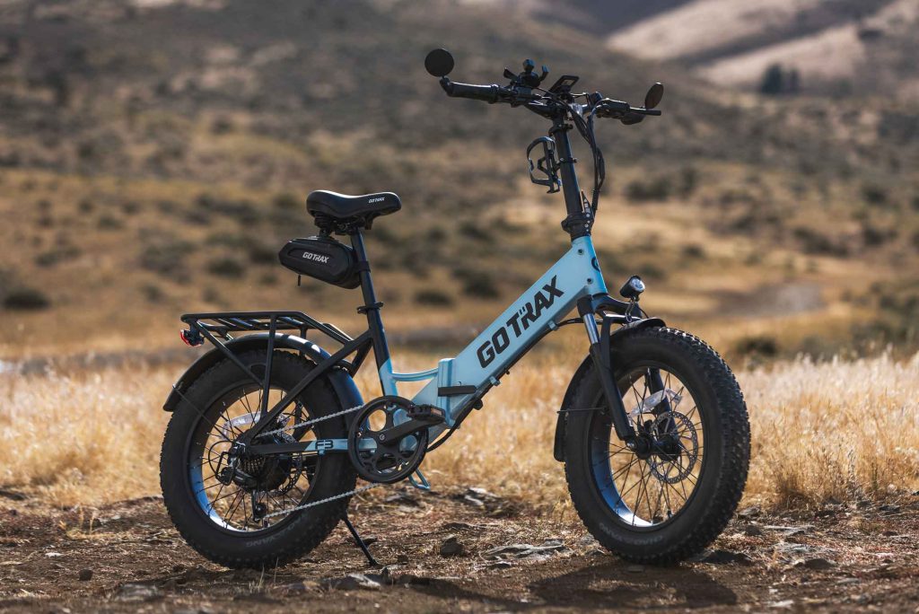  electric bike product photography highlighting folding design and portability of blue GoTrax F3
