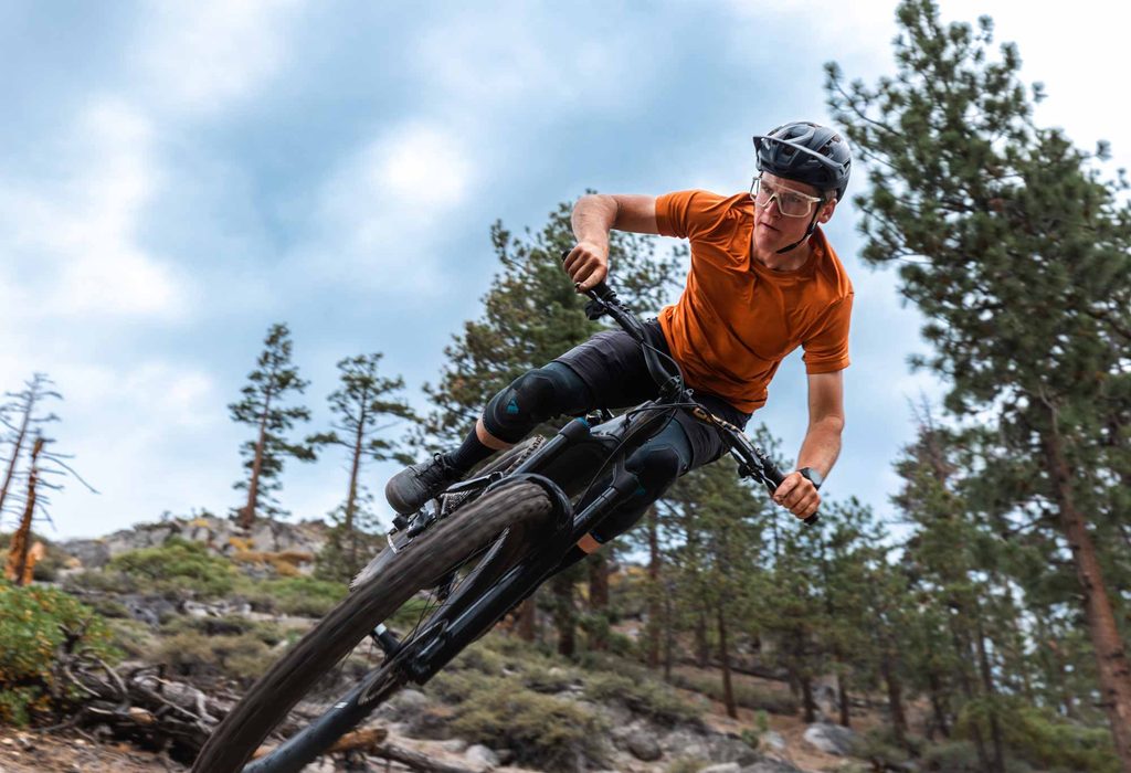 Specialized Levo e-mountain bike jump photographed on technical Tahoe terrain