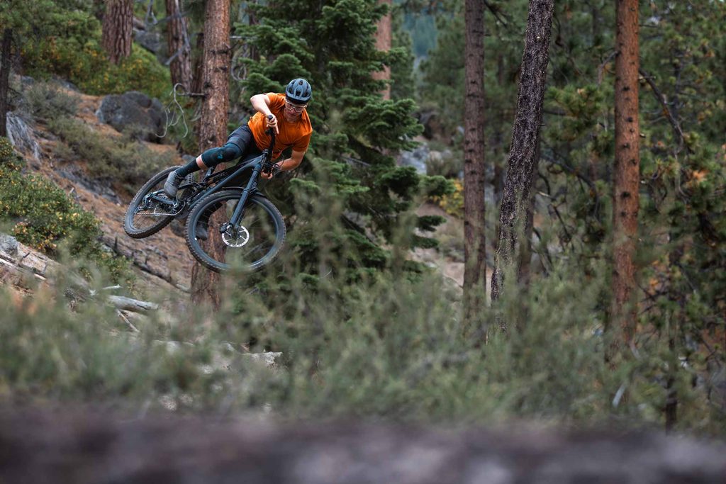 Treyton Maskaly jumping a Specialized Levo e-MTB on a technical Lake Tahoe trail